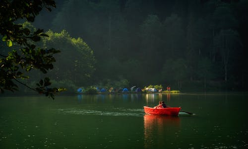 People Boating on Lake