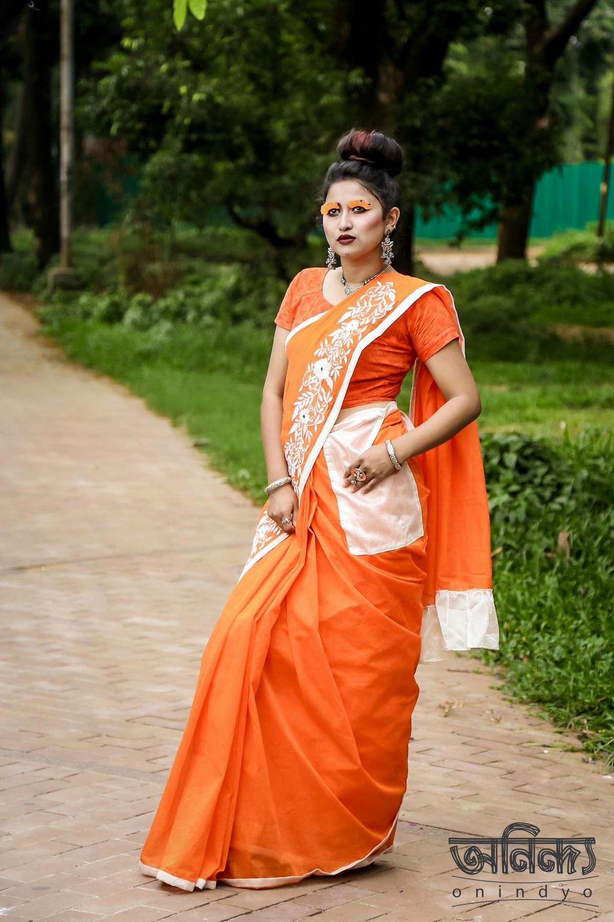 Cricketer celebrating a milestone with teammates on the field