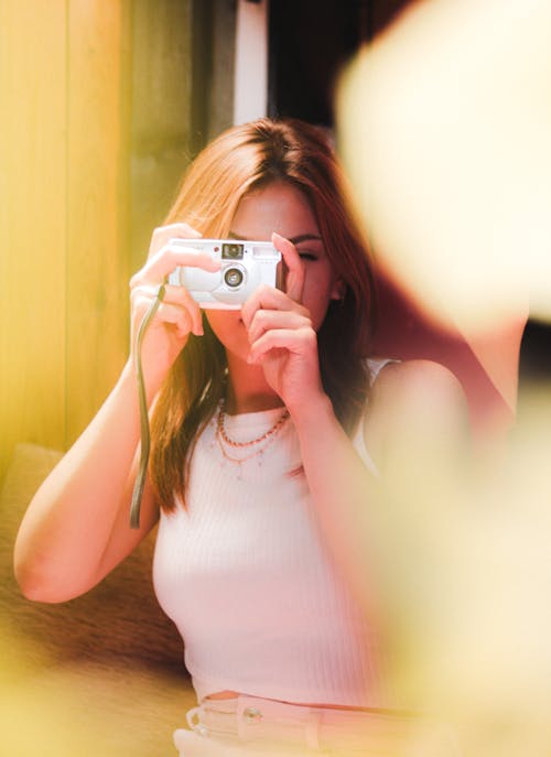 Woman Taking Pictures with Camera