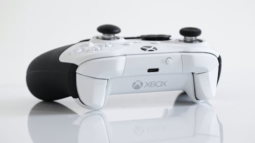Black and White Photography of a Game Controller 