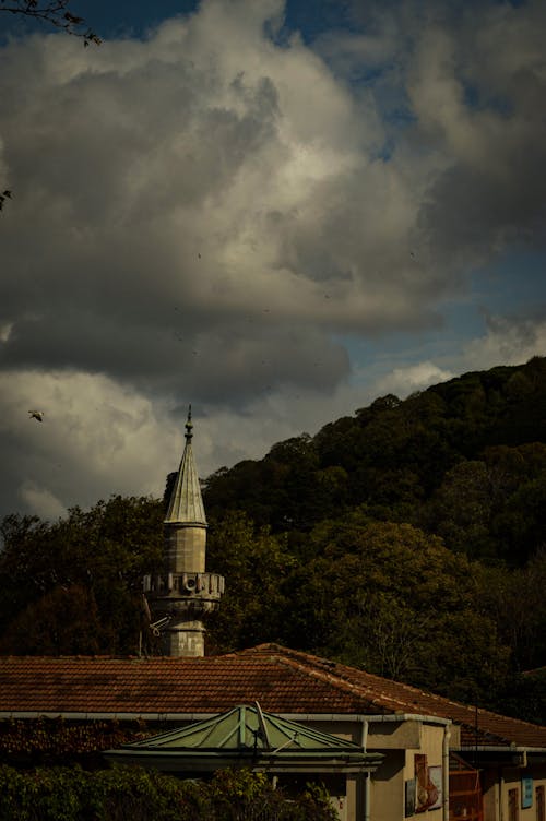 Minaret behind Building in Village