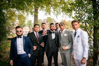 Groom in Tuxedo with Wedding Guests