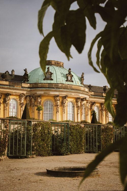 Free Captivating view of Sanssouci Palace in Potsdam, Germany, framed by lush greenery. Stock Photo