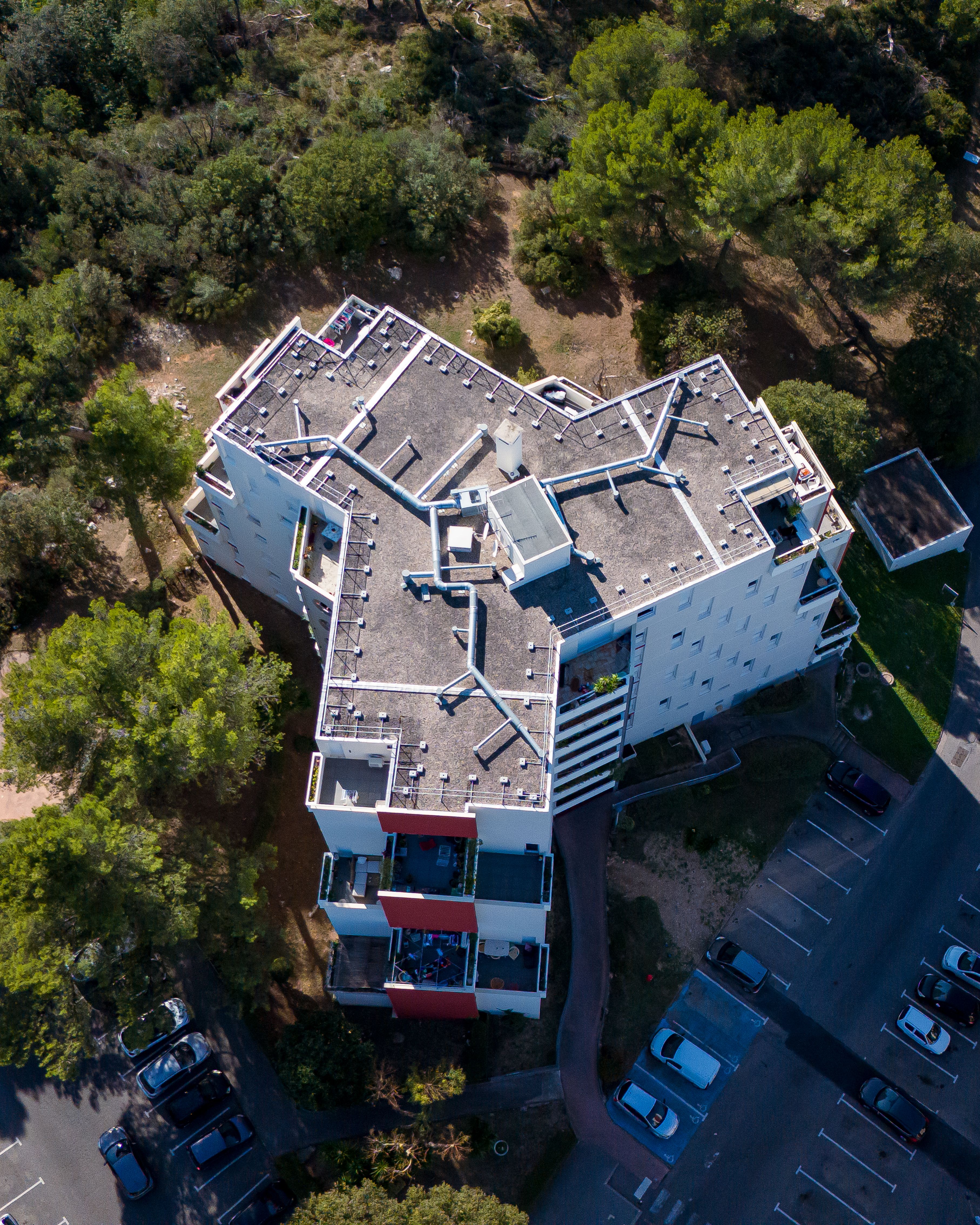 Aerial drone view of a urban building from top. · Free Stock Photo
