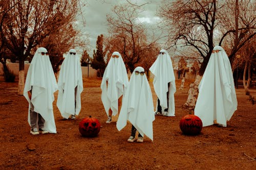 Children Dressed as Ghosts with Sunglasses in the Park