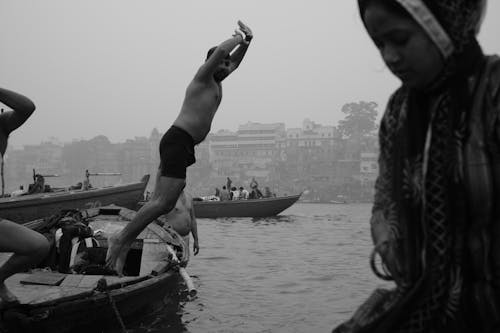 Swimmer Jumping To City River