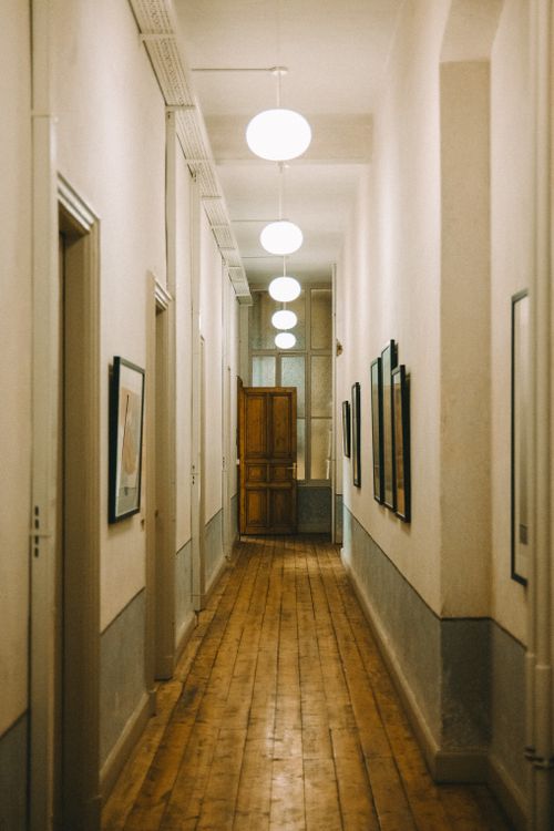 Free Cozy corridor in an İstanbul building, featuring warm lights and wooden flooring. Stock Photo