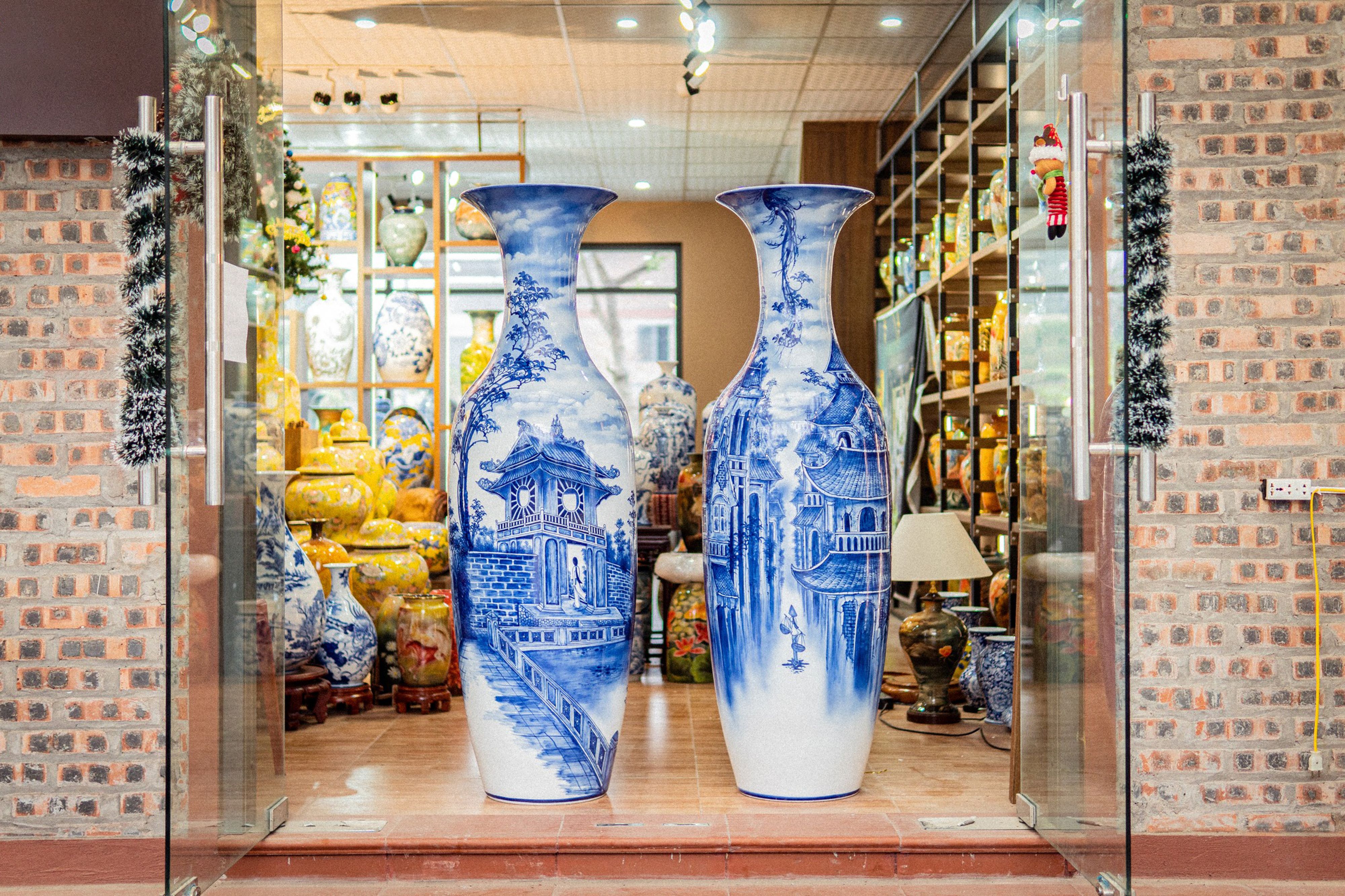 Beautiful ceramic vases with intricate blue designs in a Hanoi store display.