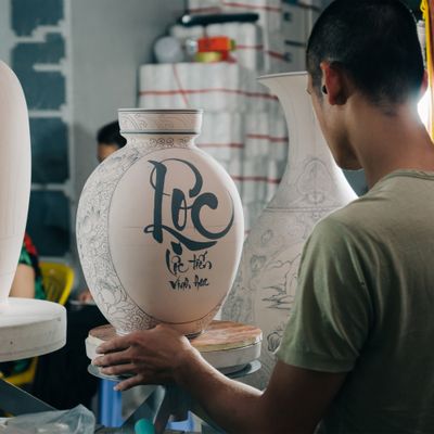 Artisan painting a porcelain vase by Su Bat Trang on Pexels