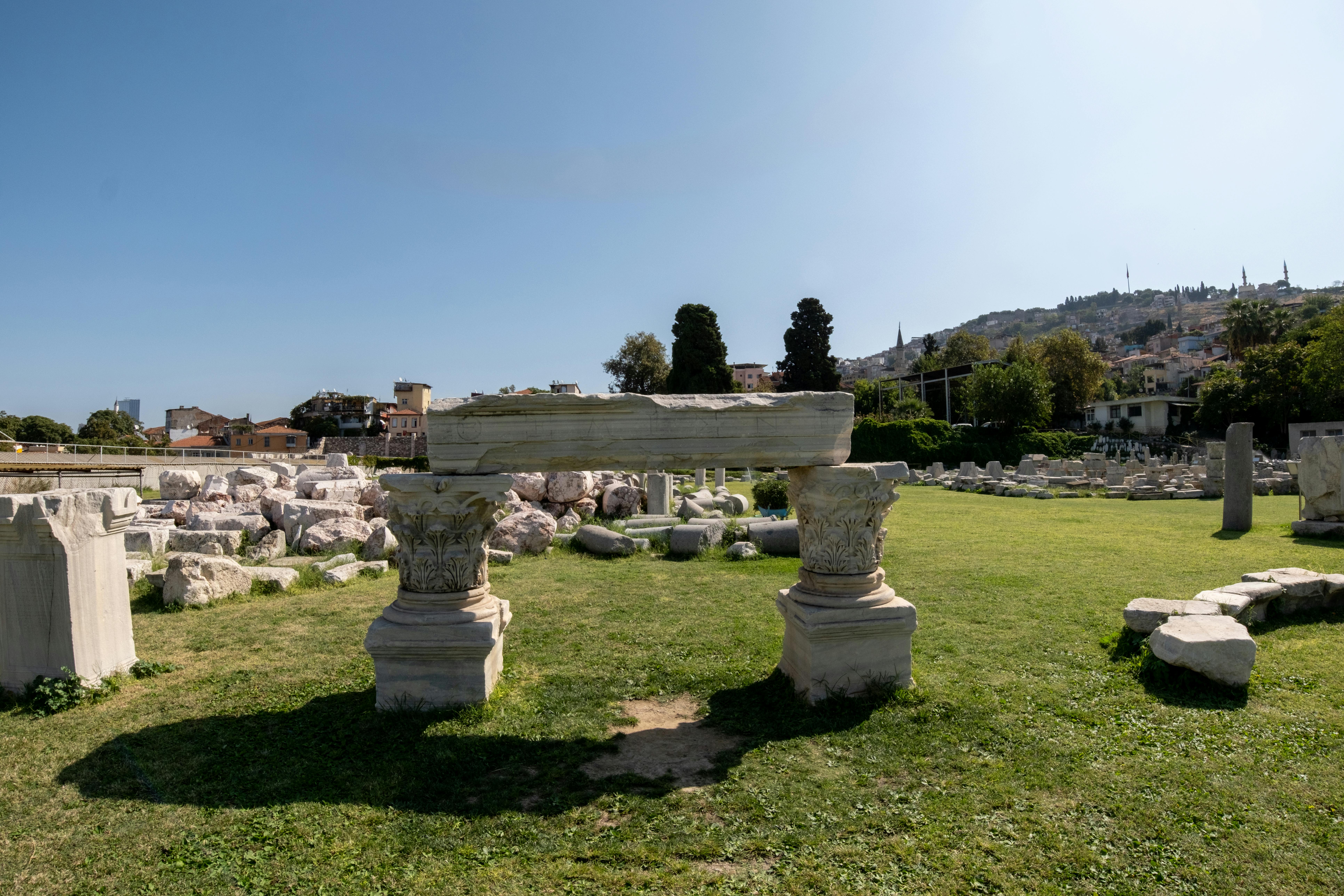 Explore the ancient marble ruins of the Agora in İzmir, Türkiye, under a clear sky.