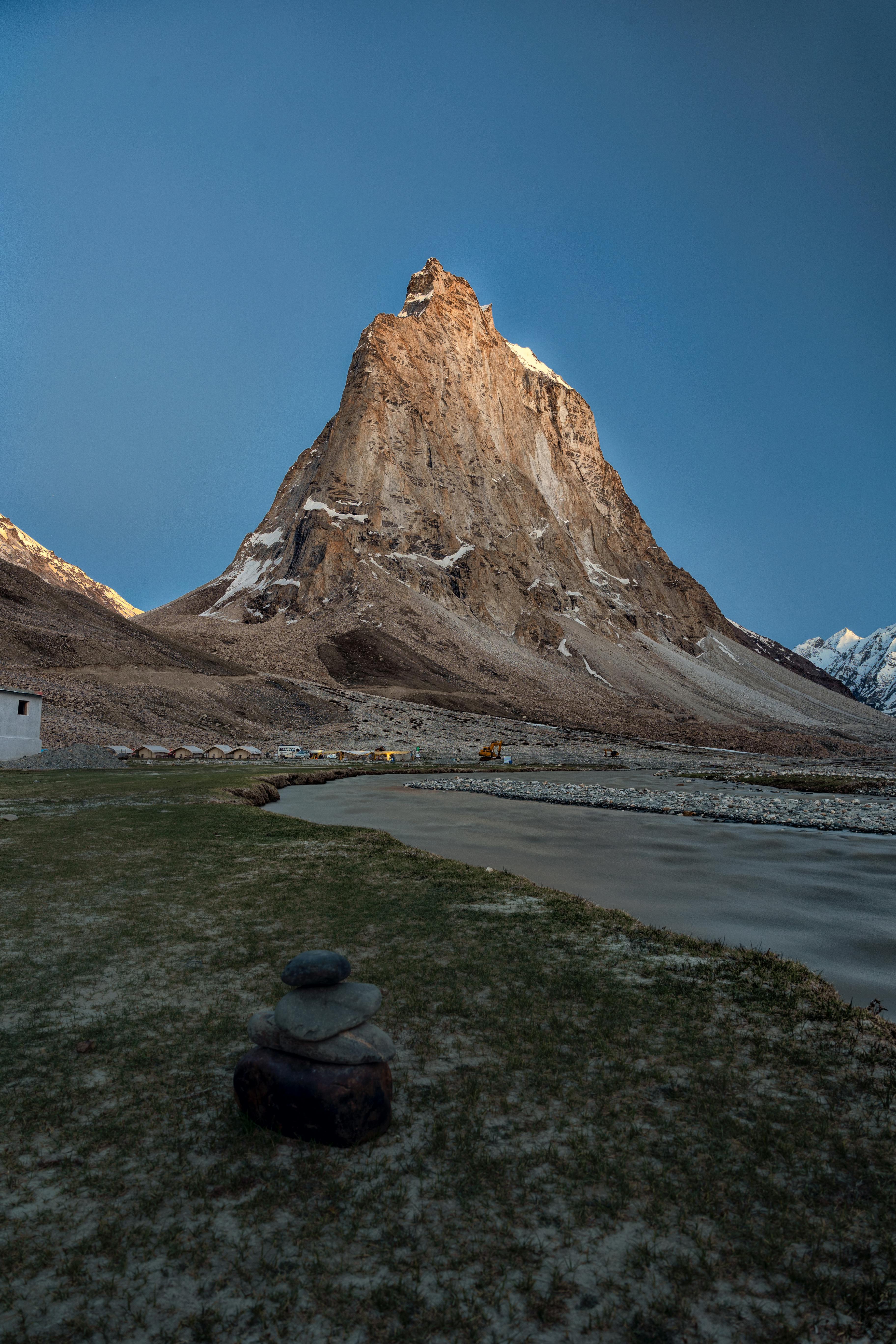 the kargyak river with the granite mountain peak of mount gumbok rangjon on the darcha padum trekking route in the zanskar valley in ladakh