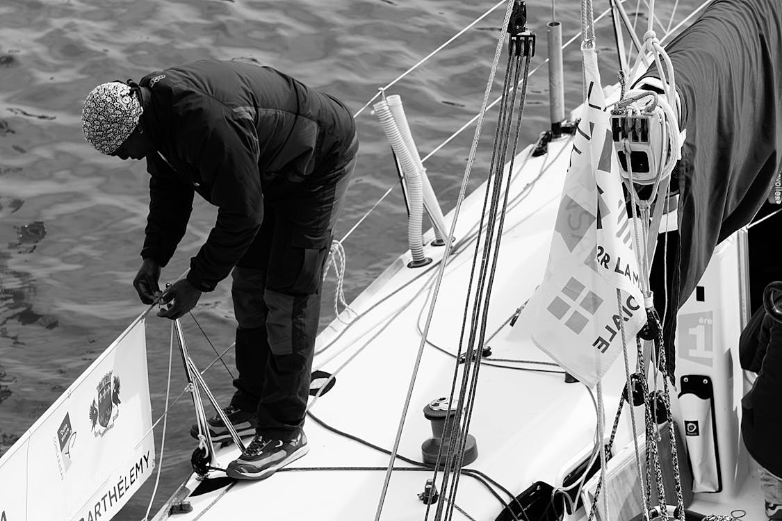 Free Man in Black Gray Jacket on a Boat's Railing Stock Photo