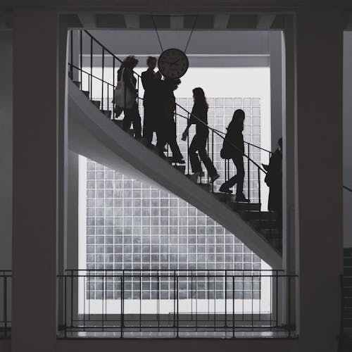 A group of people walking up a staircase