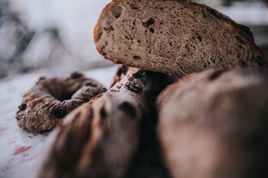 Delicious assortment of freshly baked artisan breads. Close-up view emphasizing texture and detail.