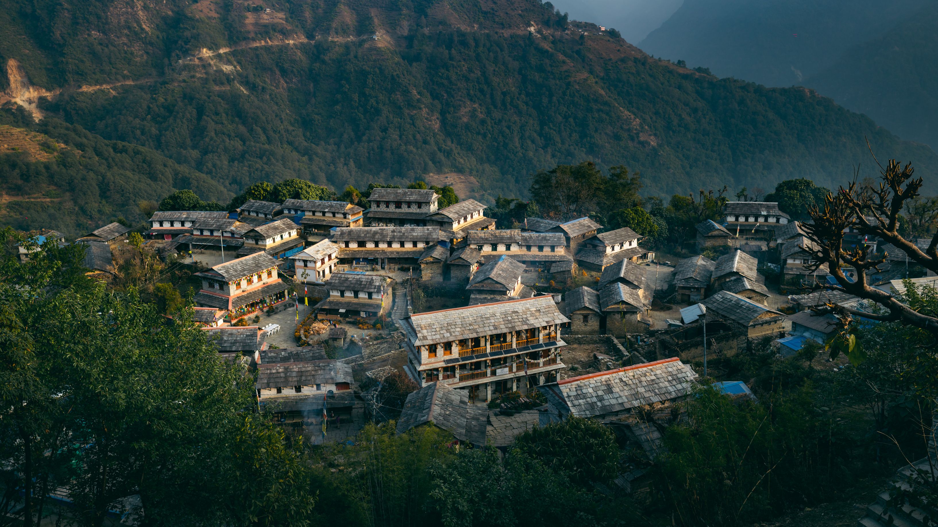Free Captivating aerial view of traditional Ghandruk village amidst lush mountains in Nepal. Stock Photo