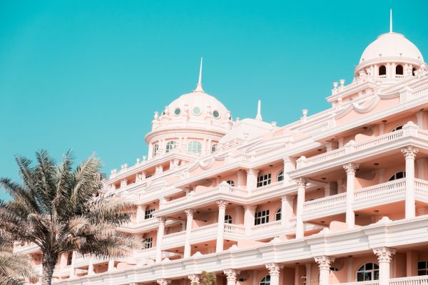 Ornate hotel facade with palm trees