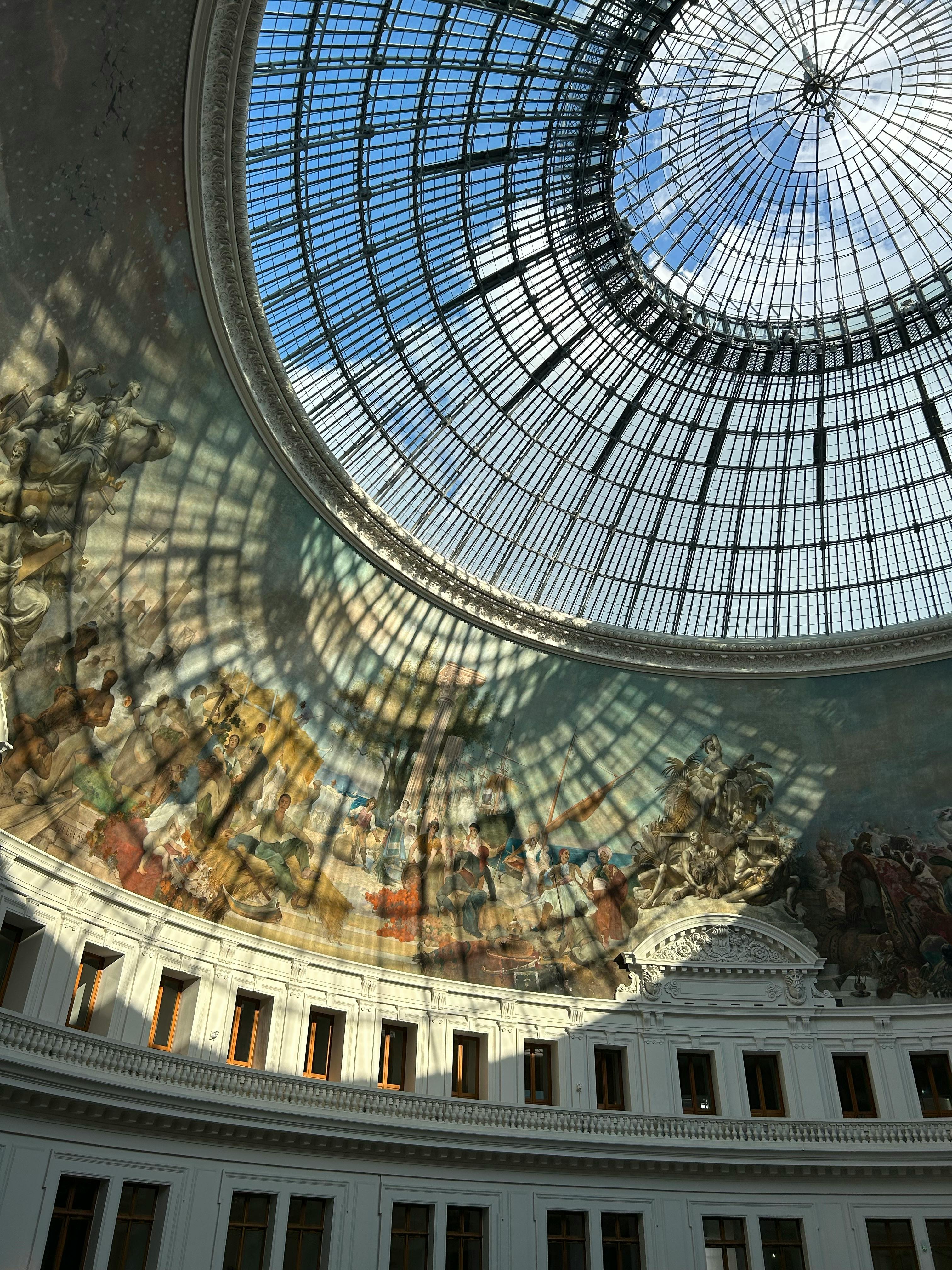 A stunning view of the magnificent dome and mural inside the Bourse de Commerce, Paris.