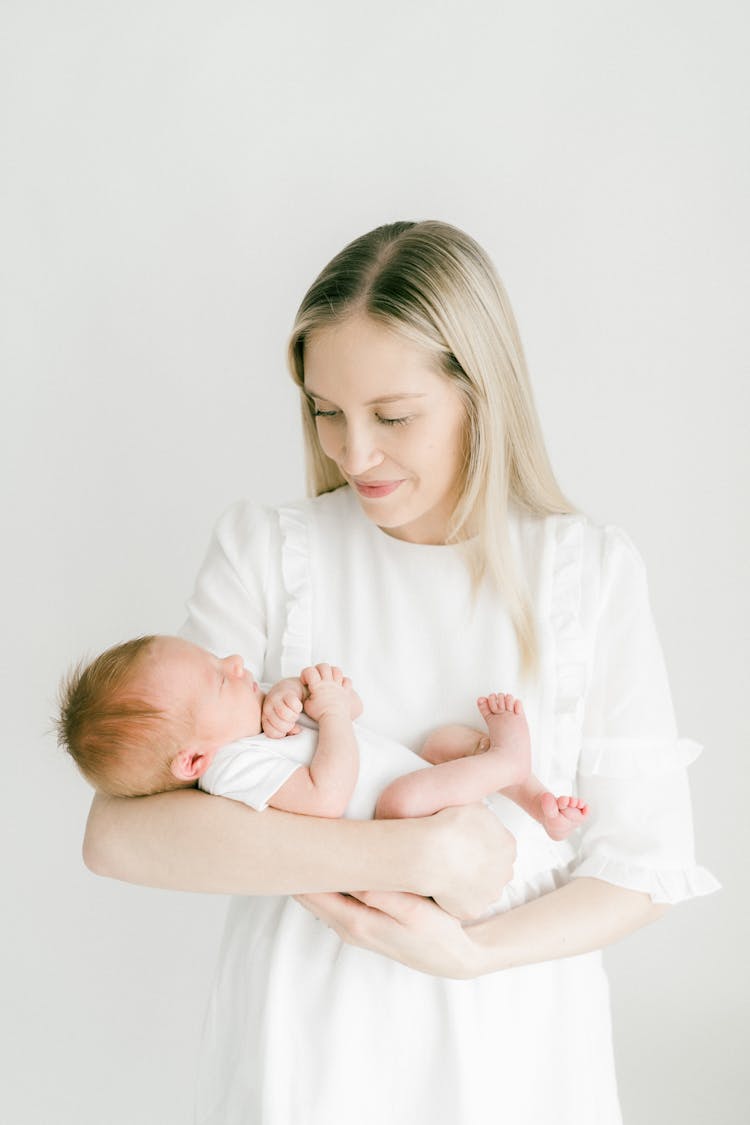 Smiling Mother Holding Baby