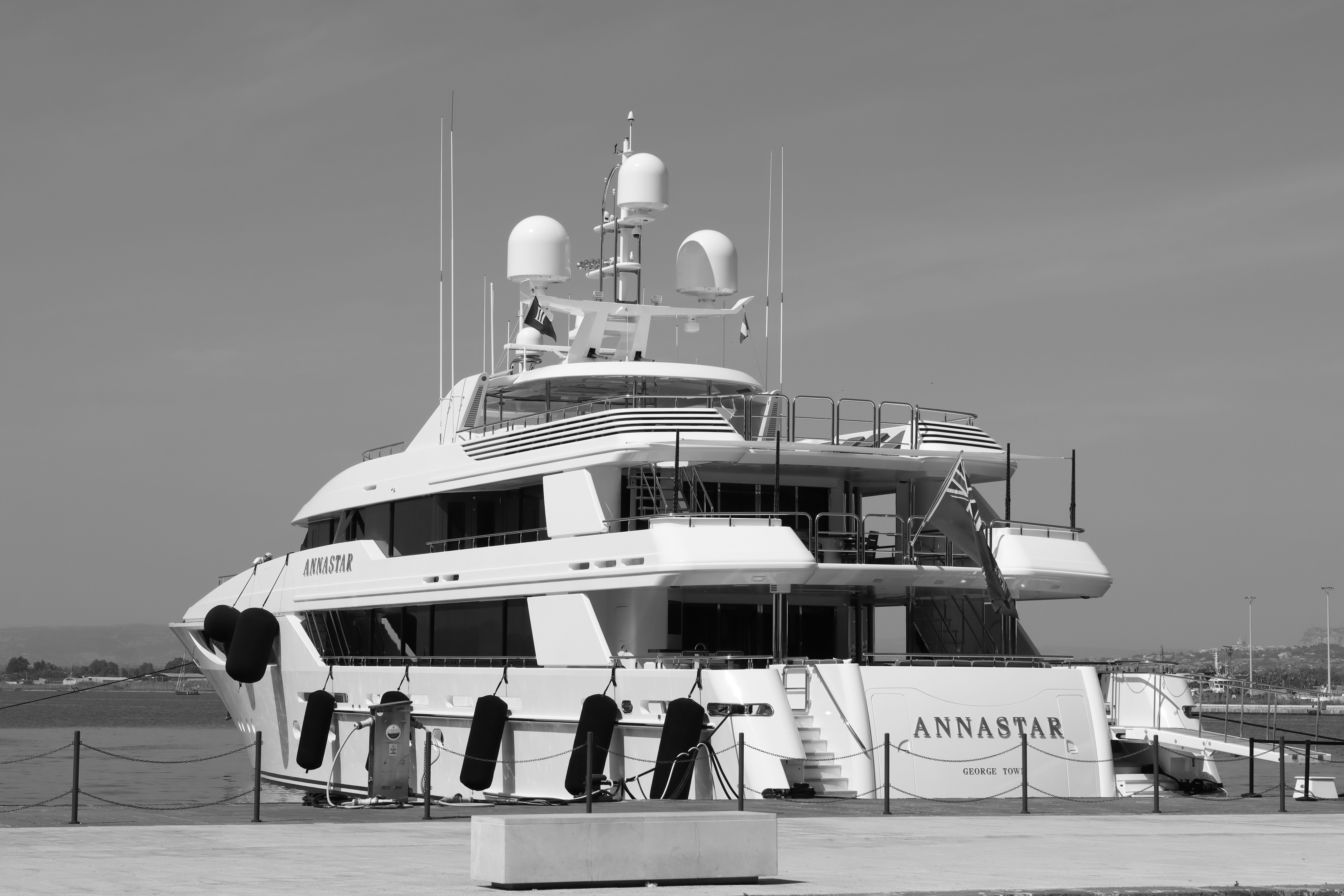 Sarasota Top Shelf with Private Coastal Day Yacht - Black and white photo of a luxury yacht docked in Syracuse, Sicily.