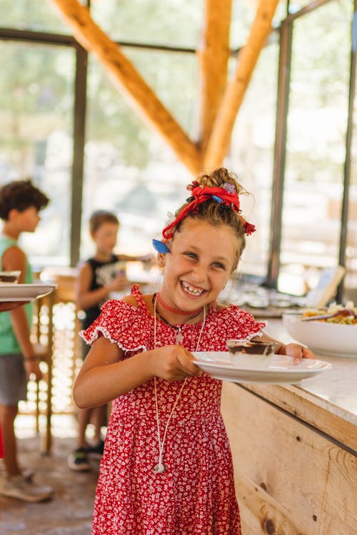 Girl in Dress with Food on Plate