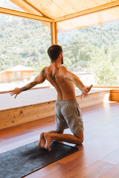 Topless Man Practicing Yoga