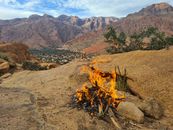 A serene campfire in the rocky mountain landscape of Tafraoute, Morocco.