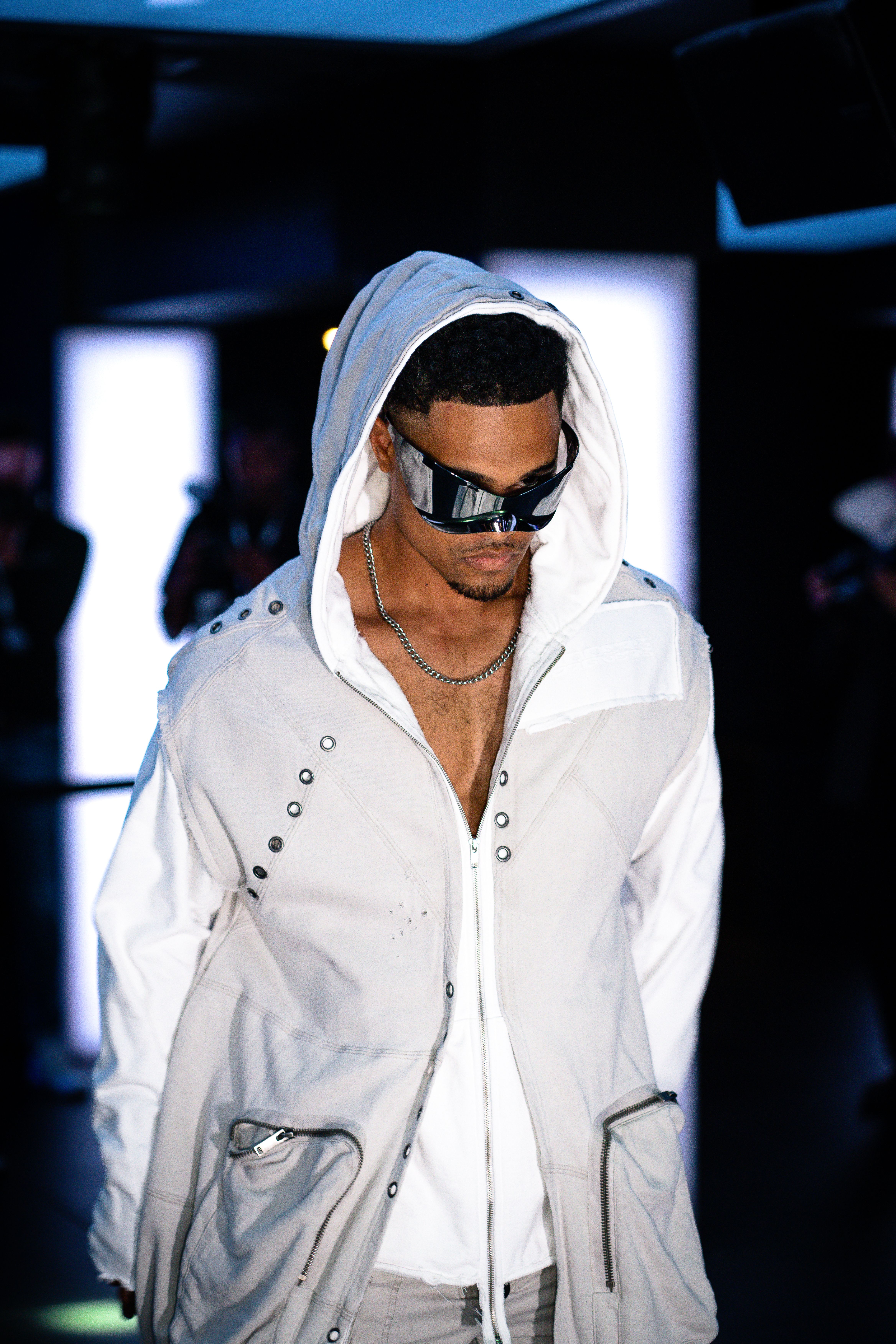White hoodie styled with a relaxed runway look