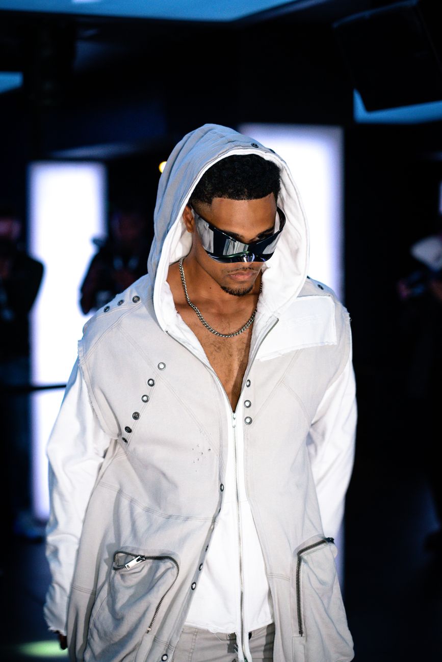 White hoodie styled with a relaxed runway look