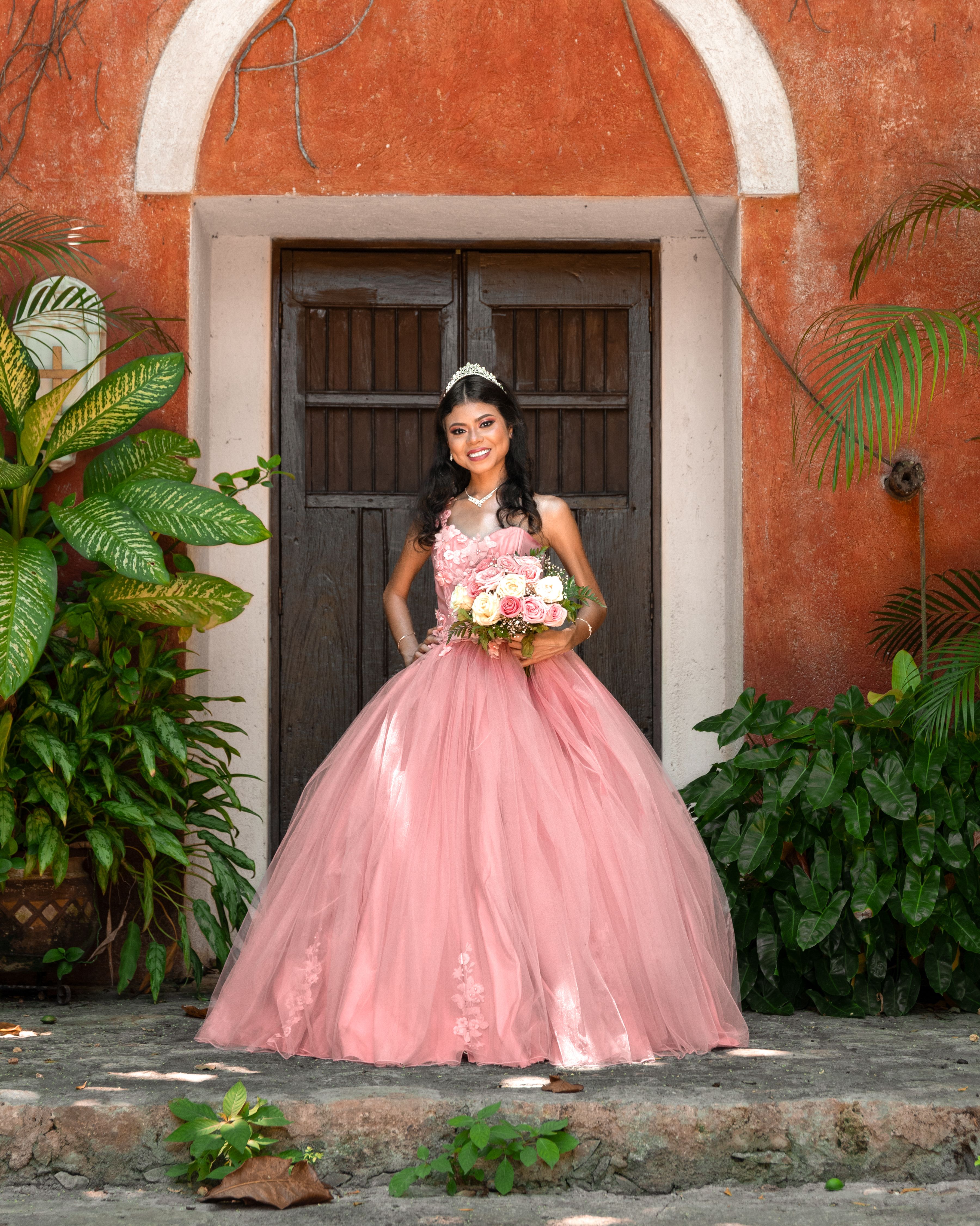 Bride in Pink Dress Standing with Flowers Bouquet · Free Stock Photo