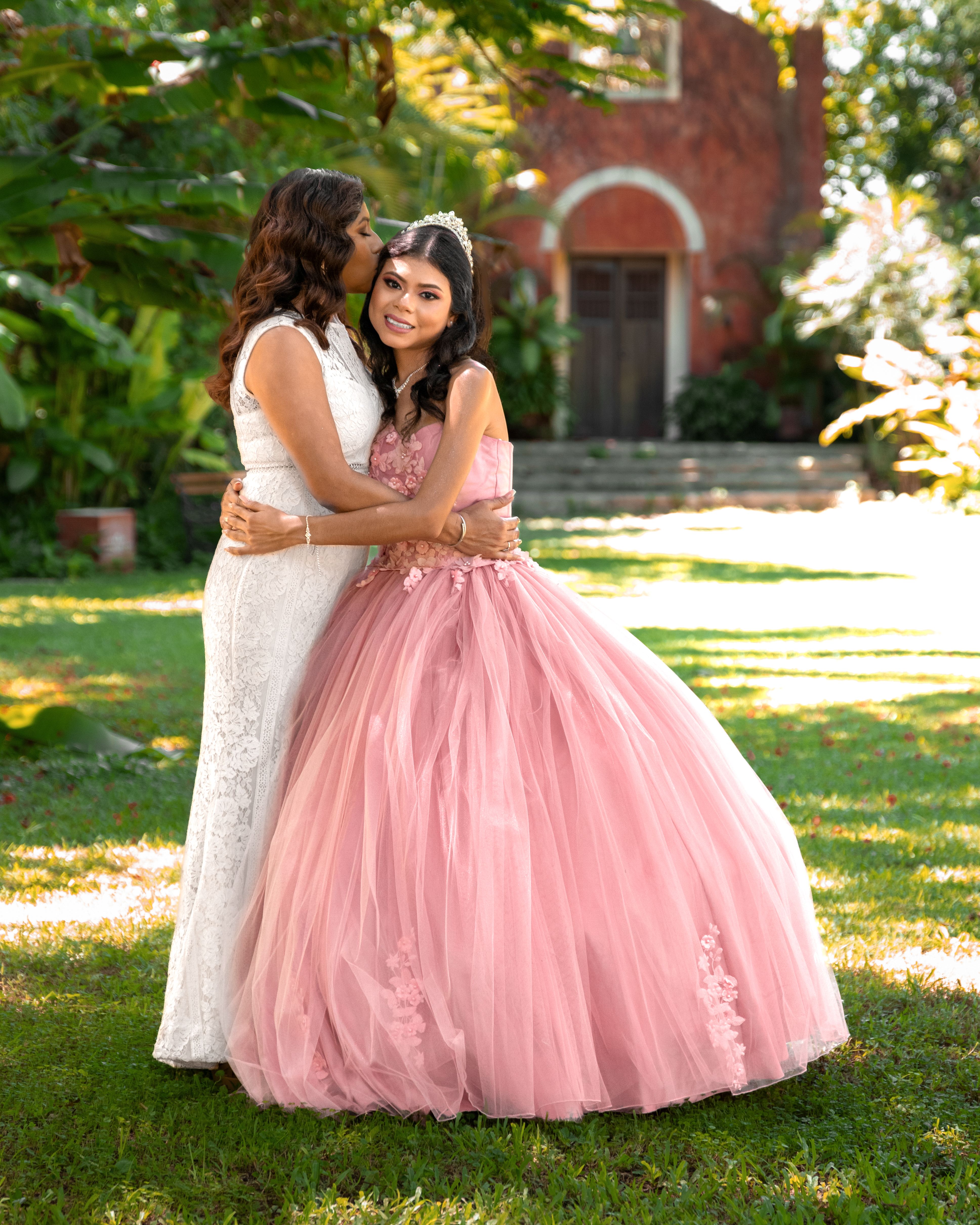 smiling-women-in-dresses-kissing-and-hugging-free-stock-photo