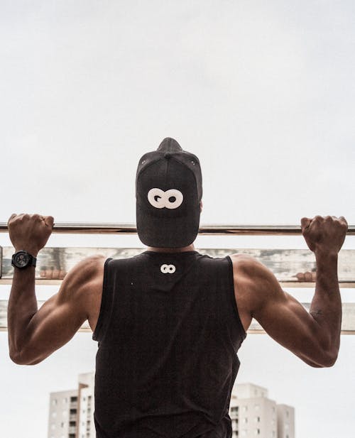 Free Man Doing Pull-Ups Stock Photo