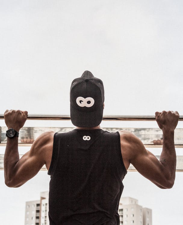 Free Man Doing Pull-Ups Stock Photo