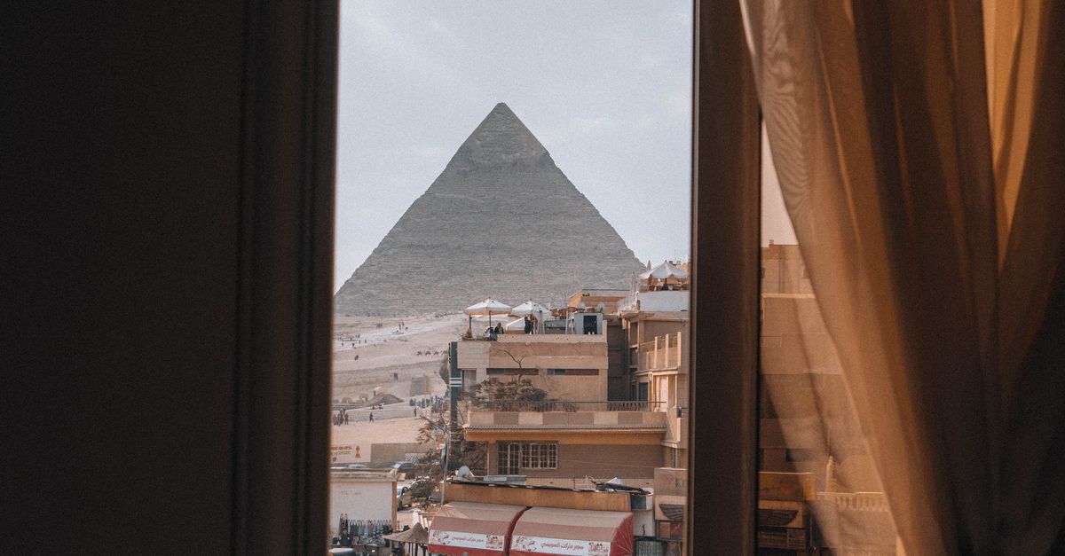 Window View Pyramids View of Great Pyramid from Cairo Window · Free Stock Photo