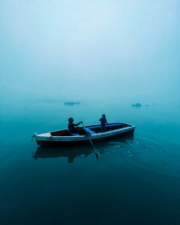 Aerial View of People in a Rowboat · Free Stock Photo