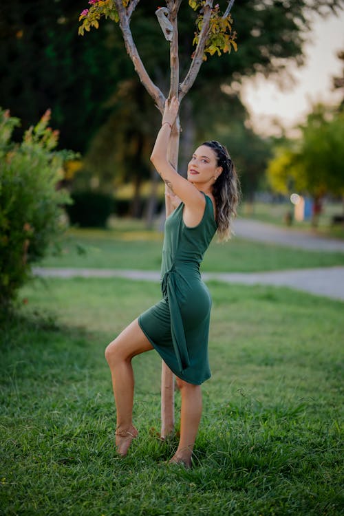 Model Posing by Tree in Park