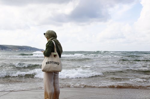 Woman in Hijab on Sea Shore