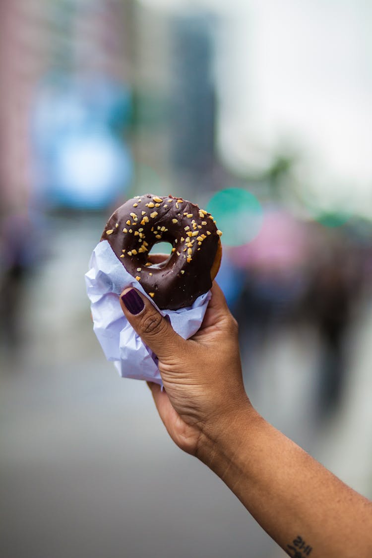 Person Holding Doughnut