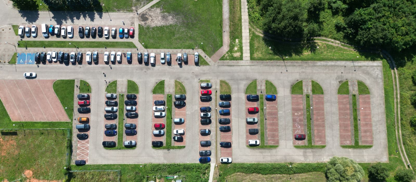 Aerial view of cars in an open-air car park