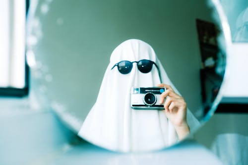 Free Ghost Taking Pictures in Mirror Stock Photo