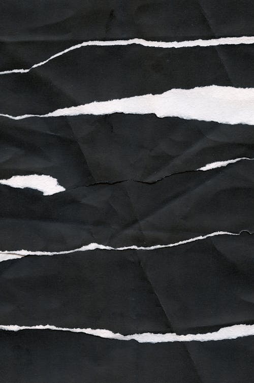 Strips of Black Cloth on White Background 