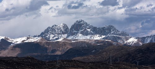 Immagine gratuita di catena montuosa, innevato, inverno