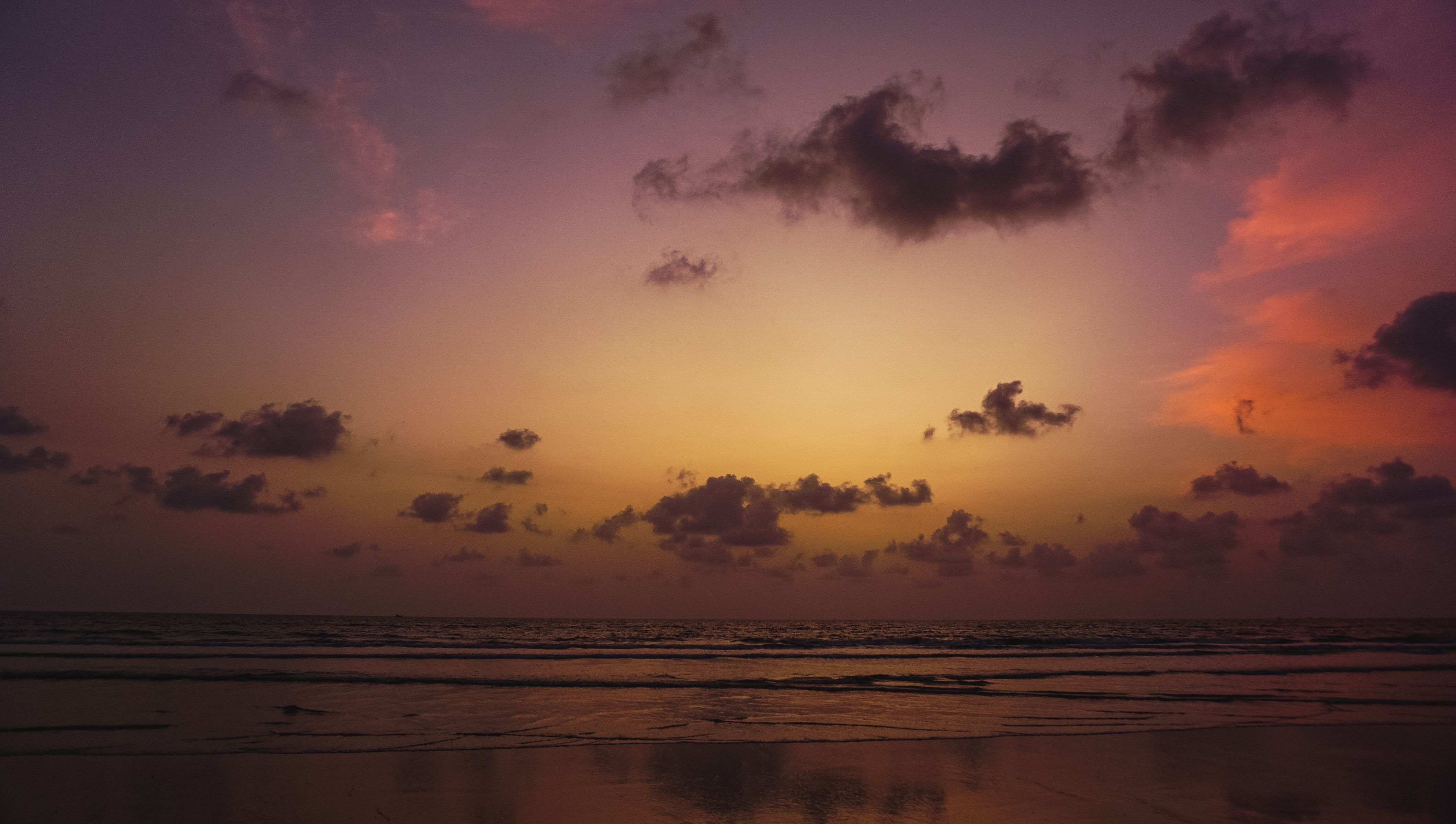 Clouds on Yellow Sky over Sea at Sunset · Free Stock Photo