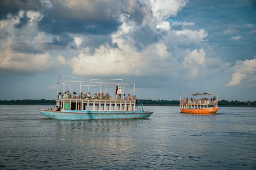 People on Boats on Lake