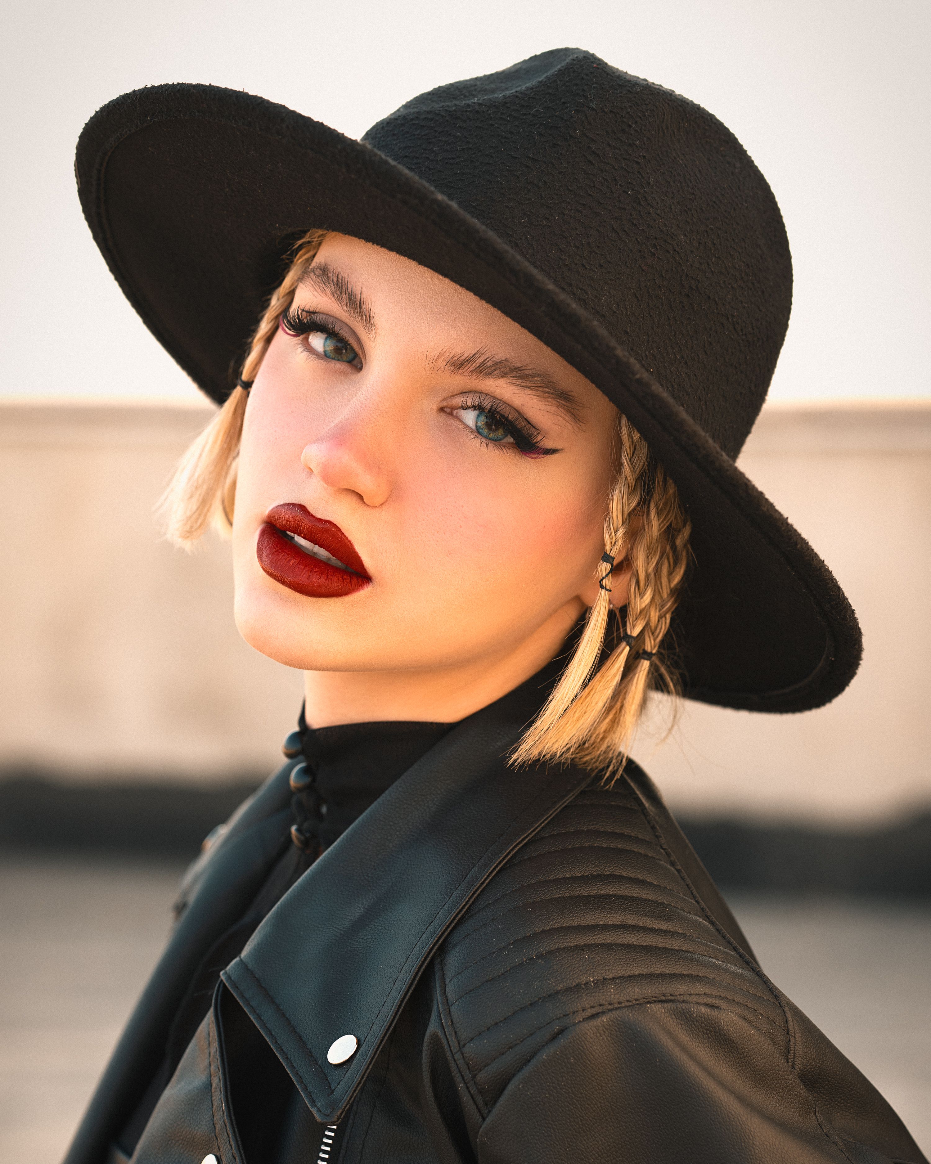 Portrait of a Young Woman in a Black Hat · Free Stock Photo