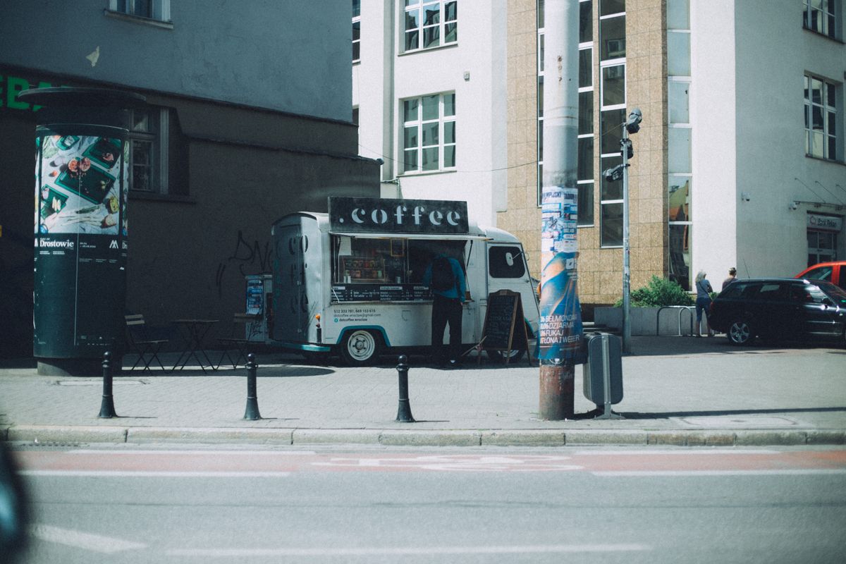 Food truck serving customers on a city sidewalk