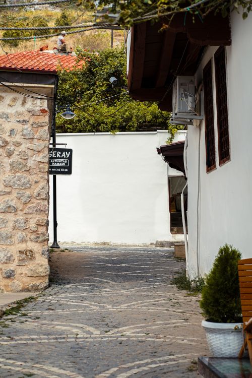 Free Explore the narrow cobblestone streets of a historic village in Turkey, showcasing ancient architecture. Stock Photo