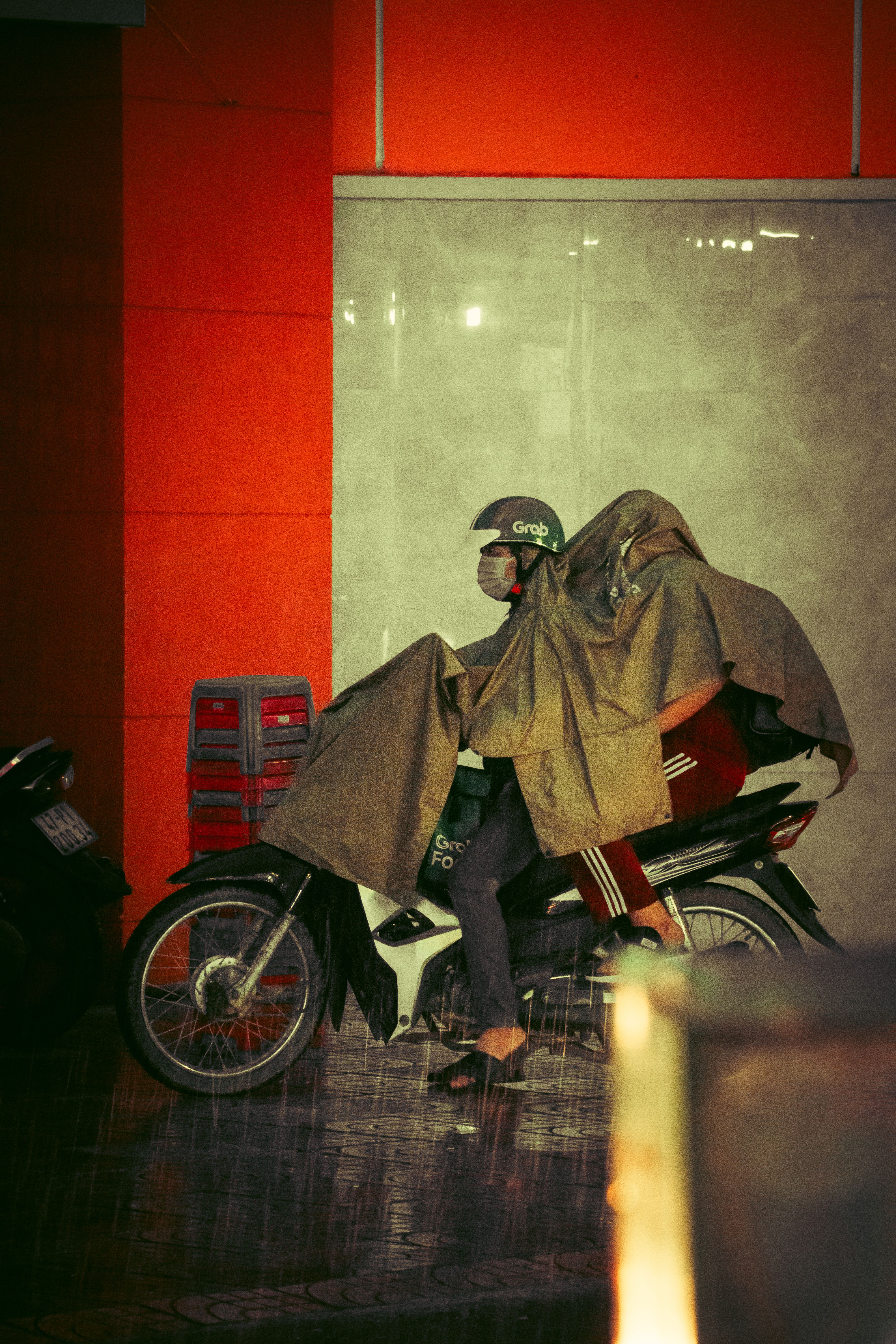Man Riding Motor Scooter in Rain · Free Stock Photo