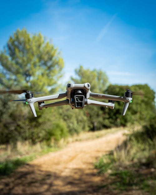 View of Dji Air 3 drone flying in the forest in south of France.