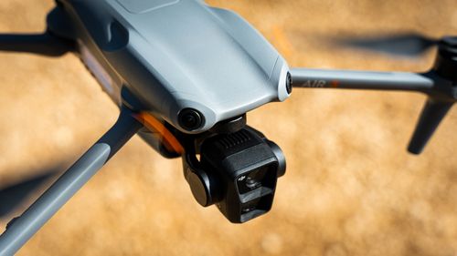Free A close-up shot of a drone flying outdoors in Marseille, France, highlighting its camera. Stock Photo