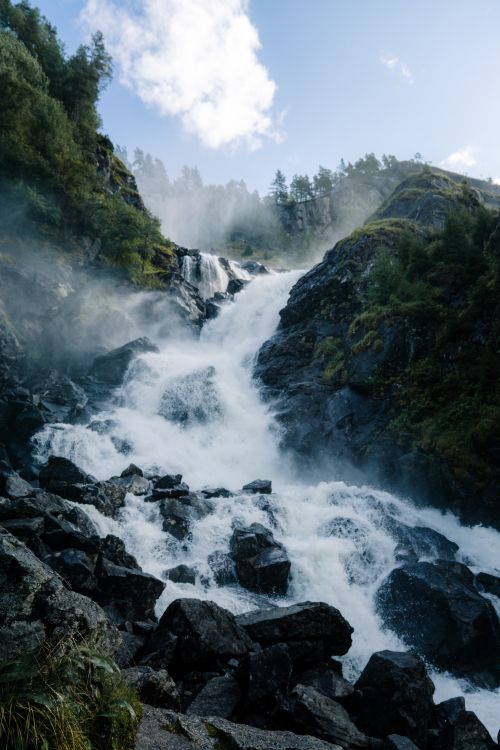 Free Scenic view of a cascading waterfall in Ullensvang, Vestland, Norway. Stock Photo